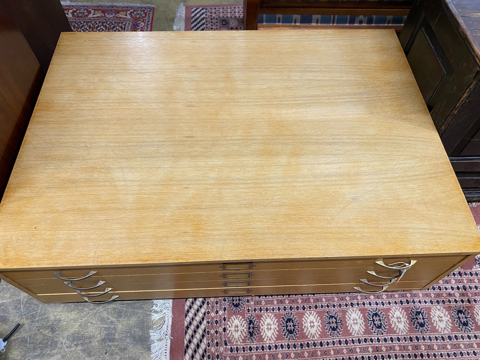 A mid century oak four draw plan chest top section, now on castors, width 130cm, depth 94cm, height 47cm *Please note the sale commences at 9am.